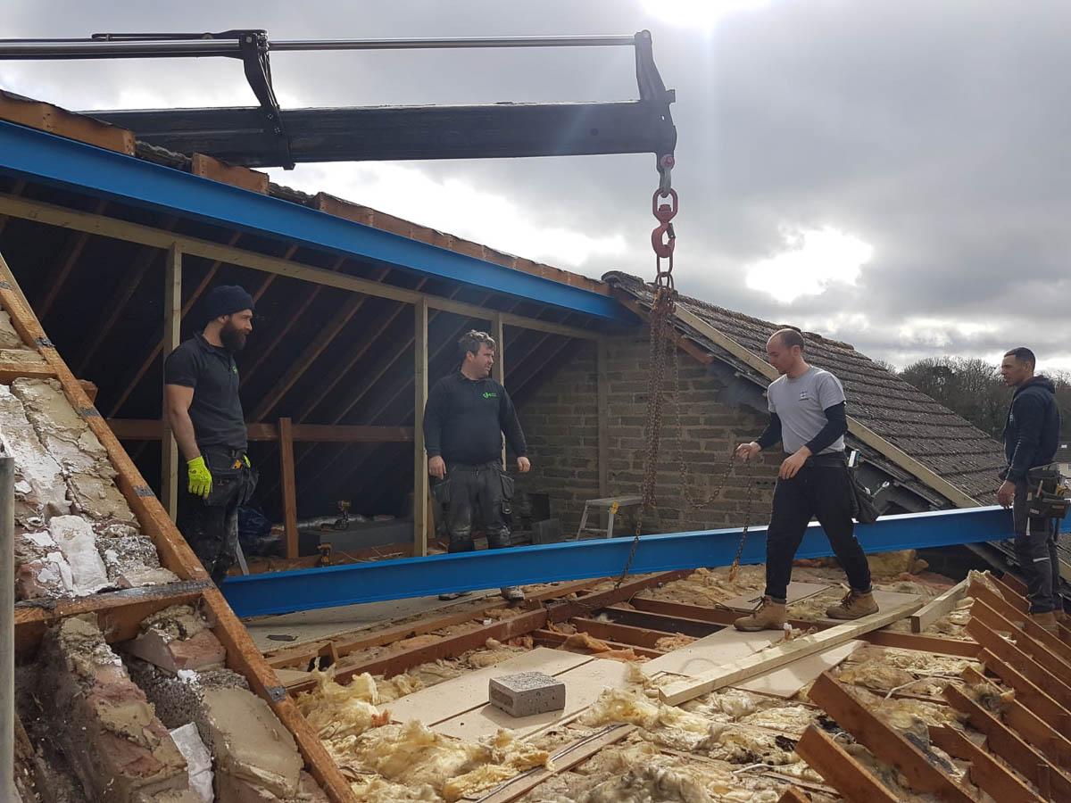 Lifting steel beams up to a loft conversion rear of the house